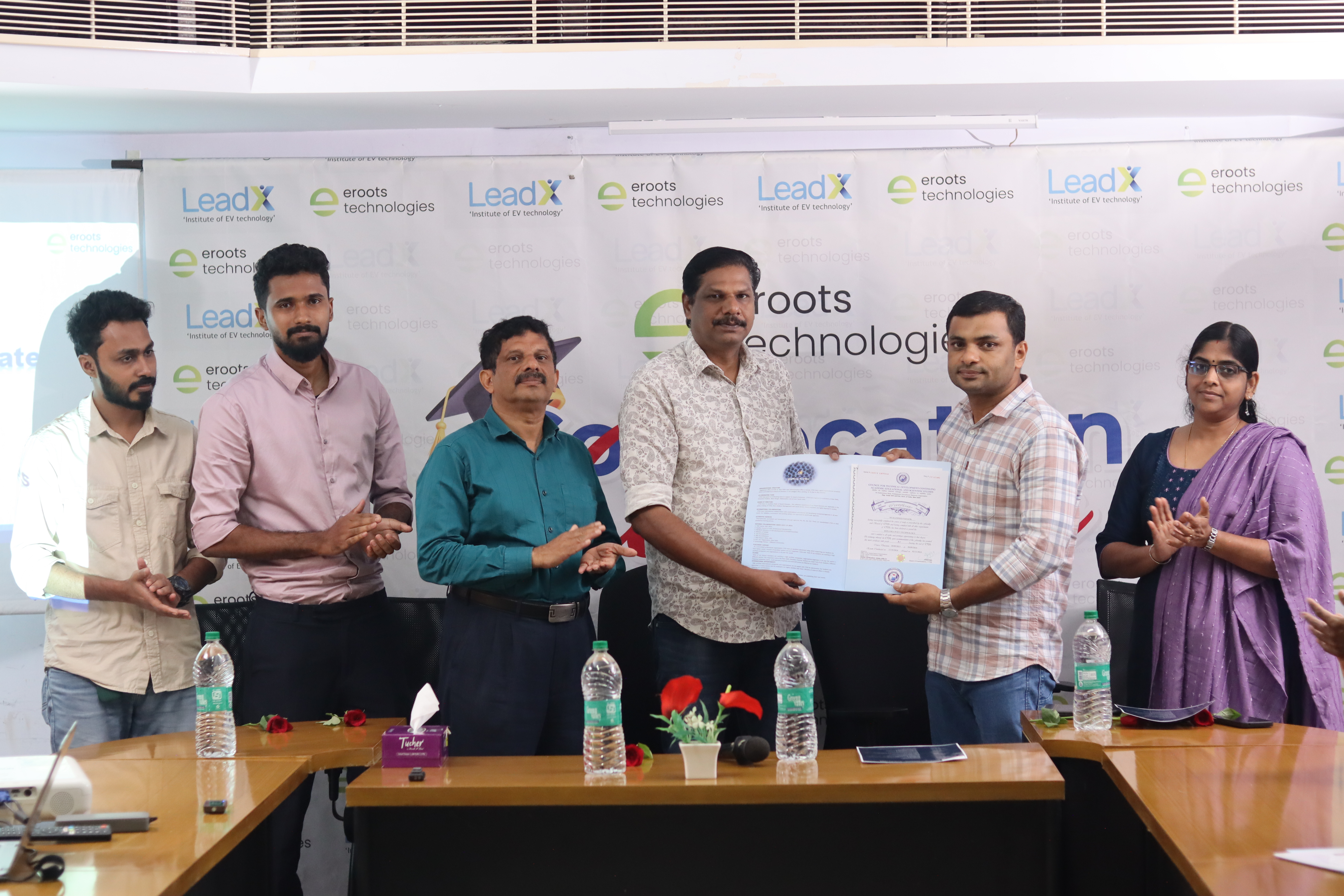 Certificate presentation during Eroots Technologies convocation.