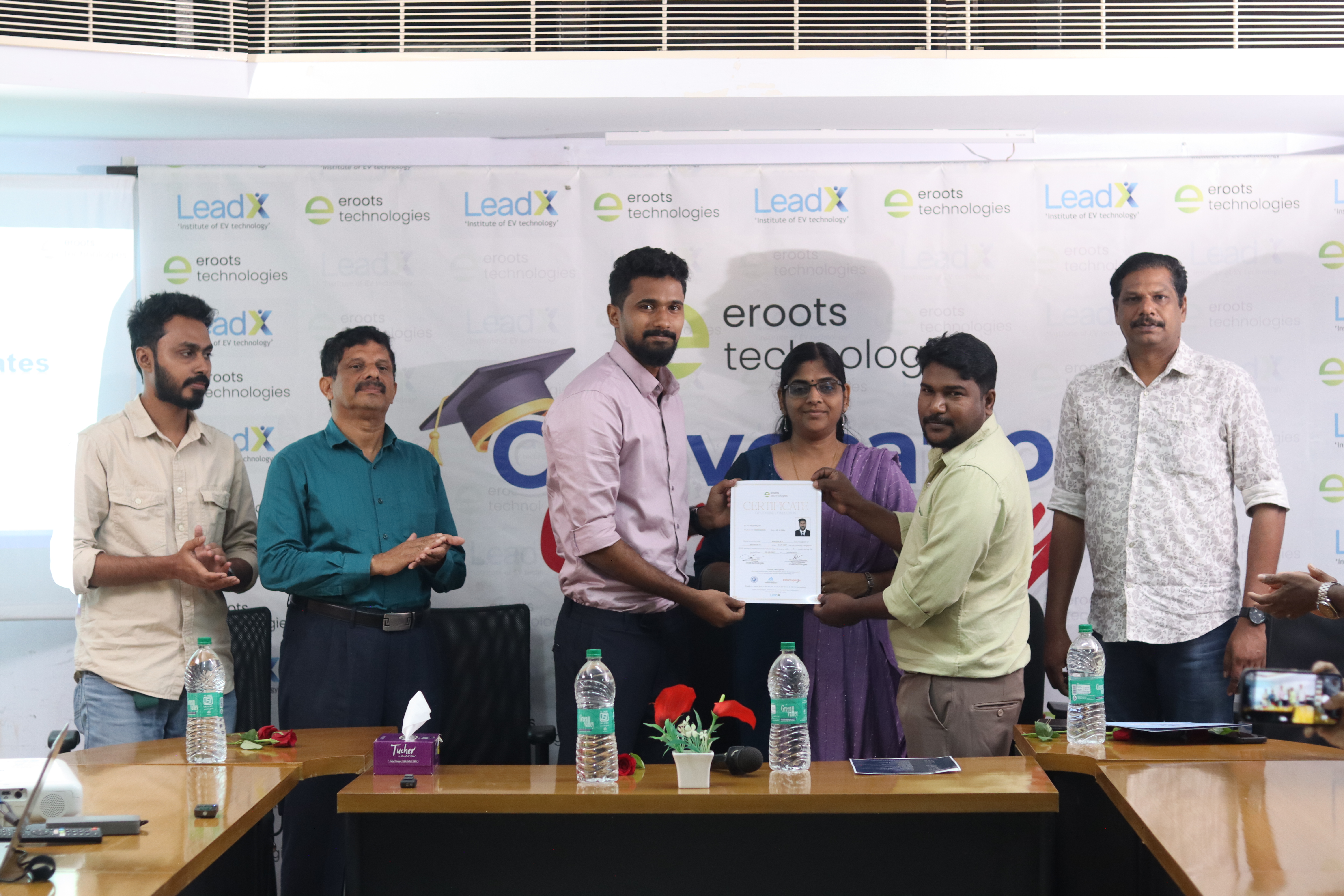 Student receiving certificate at convocation stage.