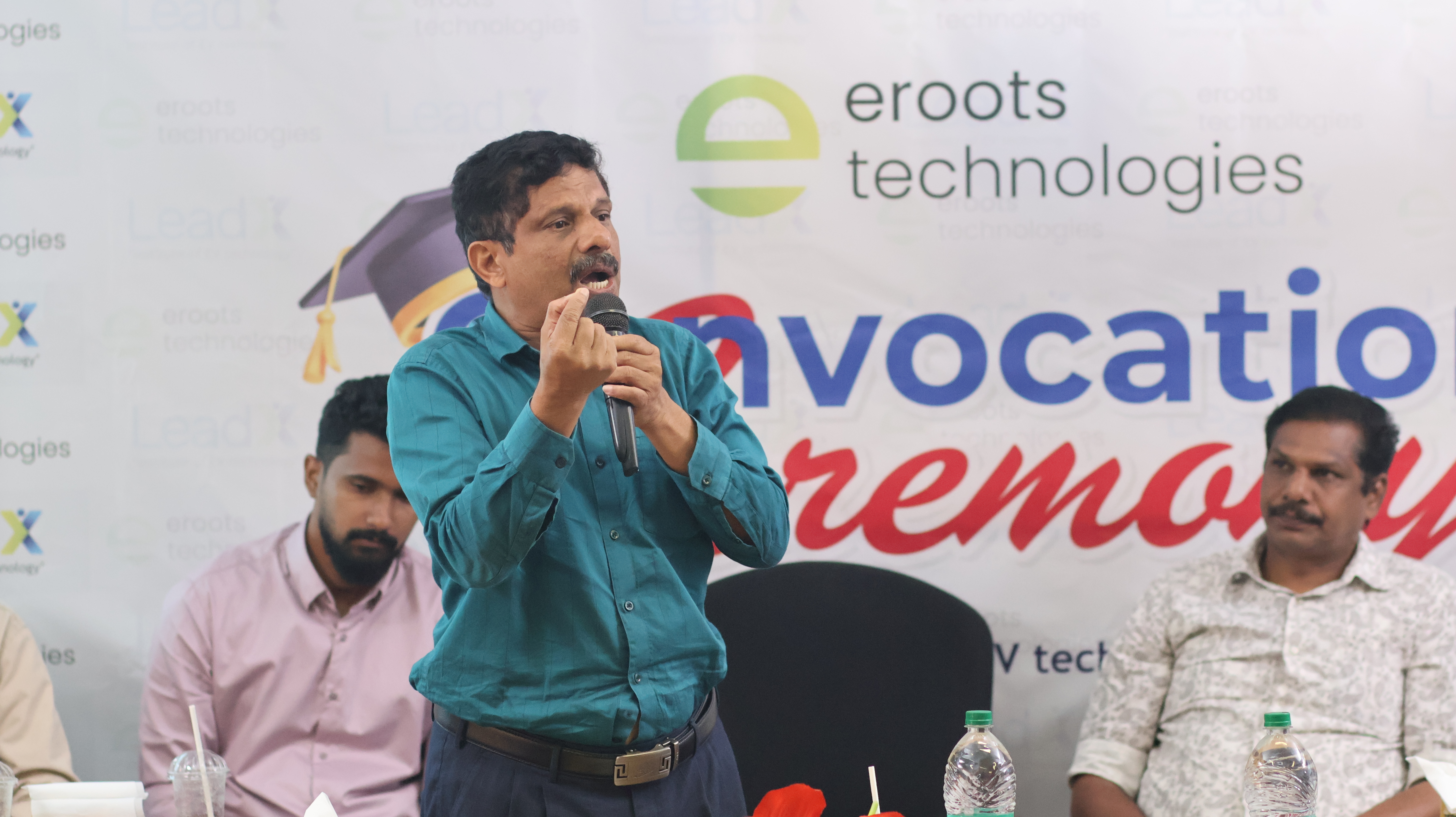 Speaker addressing students during convocation ceremony.