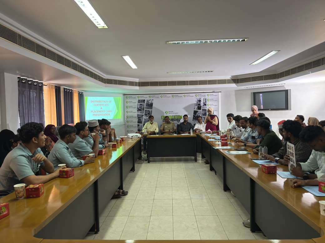 Wide event hall photo during Eroots Technologies program.